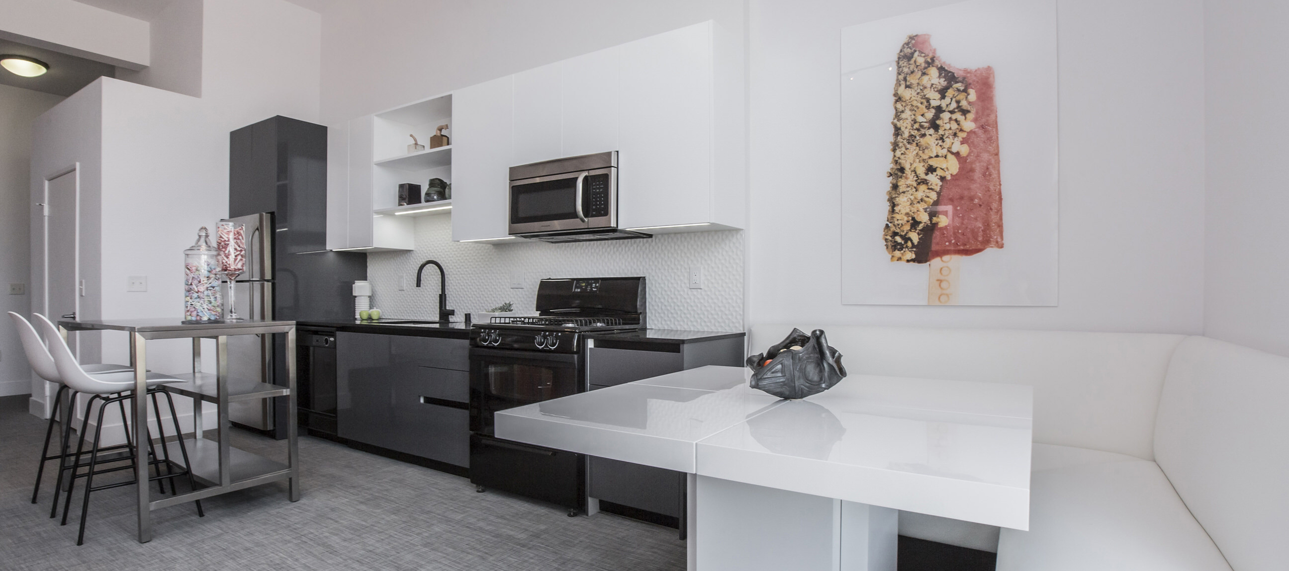 Photo of kitchen and dining area at Lofts at NoHo Commons Apartments in North Hollywood, Los Angeles.